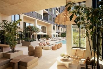 San Diego apartment for rent - A modern outdoor living space with wicker furniture and plants.
