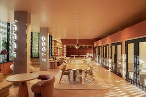 San Diego apartment for rent - A modern dining room with a long table and chairs.