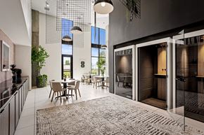 Burbank apartment for rent - A modern kitchen with a dining table and chairs.