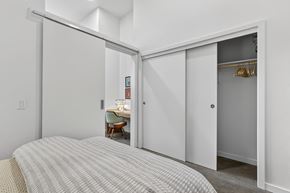 Portland apartment for rent - A bedroom with a bed and a desk in the other room.