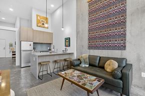 Portland apartment for rent - A modern kitchen with a bar and a couch.