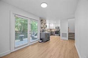 Asheville apartment for rent - A kitchen area with a dining table and chairs.
