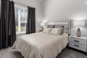 Apex apartment for rent - A bedroom with a large bed and two nightstands