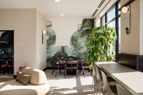 Vineyard apartment for rent - A modern dining room with a large green painting on the wall.
