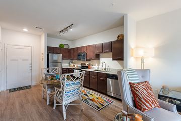 Lake Jackson apartment for rent - an open kitchen and living room with a dining table and chairs