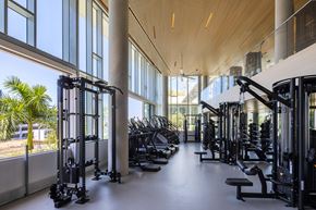 San Marcos apartment for rent - A gym with a row of treadmills and other cardio equipment.