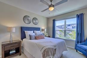 Irmo apartment for rent - a bedroom with a bed and a ceiling fan