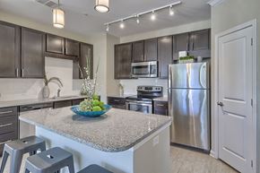 Irmo apartment for rent - a kitchen with a granite counter top and stainless steel refrigerator