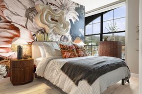 Pittsburgh apartment for rent - A bedroom with a large bed and a large floral mural on the wall.