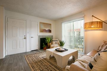 Albuquerque apartment for rent - A living room with a white couch and a coffee table.