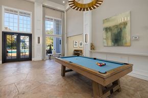 Raleigh apartment for rent - pool table in clubhouse with large windows