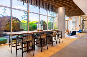 Arlington apartment for rent - a bar with high chairs and a large window with a view of the outside