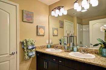 Dual sink with marble countertop in master bathroom