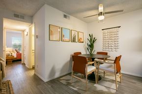 Albuquerque apartment for rent - a dining area with a table and chairs and a ceiling fan