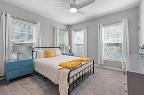 Charleston apartment for rent - A bedroom with a bed, dresser, and window with blinds.