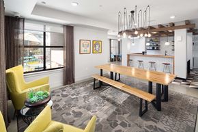 Atlanta apartment for rent - a dining room with a wooden table and yellow chairs