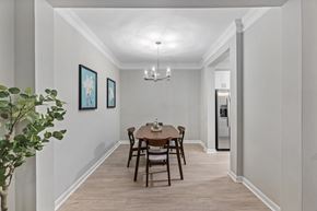Charleston apartment for rent - A dining room with a table set for two and a plant on the left.