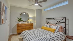 Richmond apartment for rent - A bedroom with a bed, dresser, and mirror.