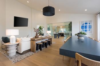 Newly renovated modern clubhouse with social seating, large flat screen tv, coffee bar, and wi-fi lounge