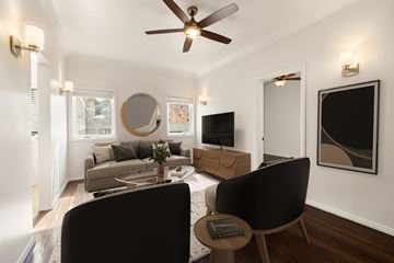Los Angeles apartment for rent - A living room with a black chair and a grey couch.
