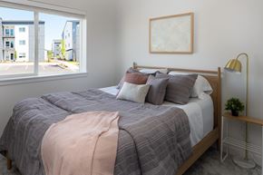 Vancouver apartment for rent - Bedroom with a bed, pillows, a blanket, a lamp, and a framed picture on the wall at The Arvon, Vancouver,98662