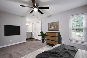 Wake Forest apartment for rent - a bedroom with a bed and a ceiling fan