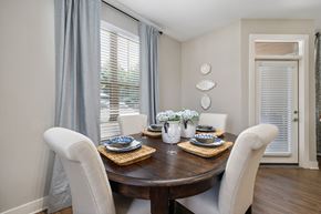Raleigh apartment for rent - A dining room with a table set for two.