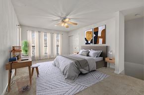 Chapel Hill apartment for rent - a bedroom with a bed and a ceiling fan