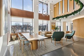 Brighton apartment for rent - A modern conference room with a long table and chairs.
