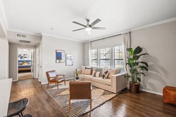 Arlington apartment for rent - a living room with a couch and a ceiling fan