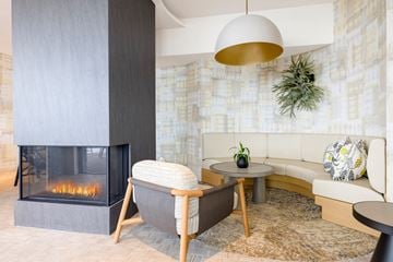 Washington apartment for rent - a living room with a fireplace and a couch