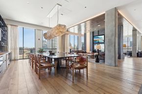 Chicago apartment for rent - A modern dining room with a wooden table and chairs.