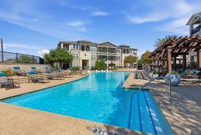 San Antonio apartment for rent - A swimming pool with a blue tiled edge and a white line in the middle.