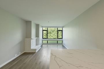 San Francisco apartment for rent - a living room with a large window and a marble table