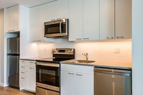 Philadelphia apartment for rent - a kitchen with stainless steel appliances and white cabinets
