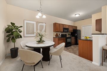 Fayetteville apartment for rent - A modern kitchen with a dining table and chairs.
