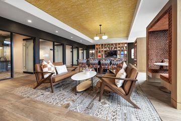 Pittsburgh apartment for rent - A modern living room with a wooden sofa and a coffee table.