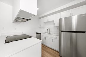 Chula Vista apartment for rent - a white kitchen with stainless steel appliances and white counter tops