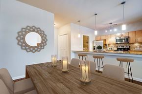 Houston apartment for rent - A dining room with a wooden table and chairs.