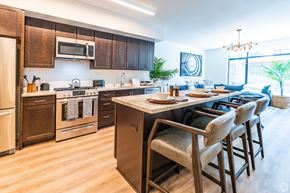 San Francisco apartment for rent - A kitchen with brown cabinets and a white countertop.
