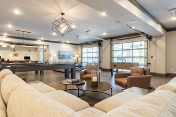 Wilmington apartment for rent - A living room with a large sectional sofa and a coffee table.