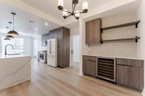 San Diego apartment for rent - a kitchen with wooden cabinets and a white refrigerator