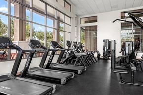 Kapolei apartment for rent - a gym with cardio equipment and windows in a building