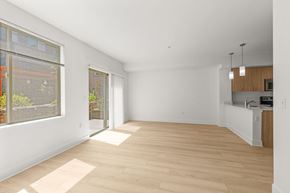 Bothell apartment for rent - A spacious room with wooden flooring and white walls.