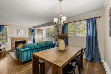 Kirkland apartment for rent - A living room with a green couch and a wooden table.
