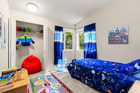 Kirkland apartment for rent - Kids bedroom with space themed bedding and toys at Hubbard's Crossing Apartments, Washington