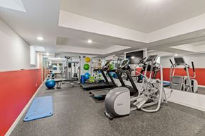 Bellevue apartment for rent - A gym with a variety of equipment including treadmills, exercise bikes, and weights.