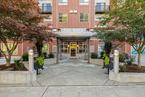 Bellevue apartment for rent - The entrance to a building named Park Metro with a glass door and a canopy.