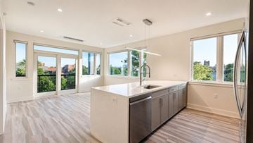 Princeton apartment for rent - A modern kitchen with a large island and stainless steel appliances.