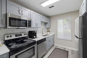 Greensboro apartment for rent - Kitchen with stove top oven at The Madison at Adams Farm, Greensboro, NC, 27407
